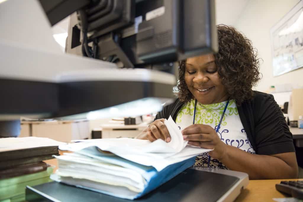 Dawn Hale, of the CMS department, works with a smile 