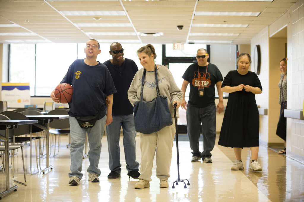 5 adult living skills participants walking