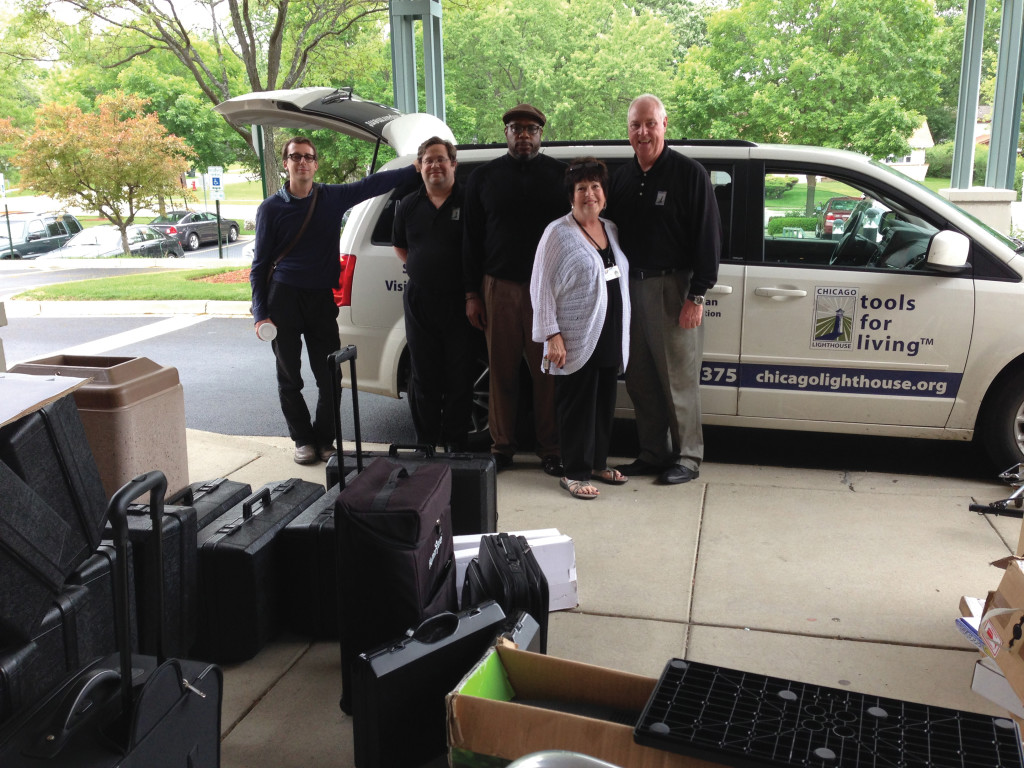 The Assistive Technology Road Show team about to load up the van to demonstrate devices to maximize remaining vision for people with low vision