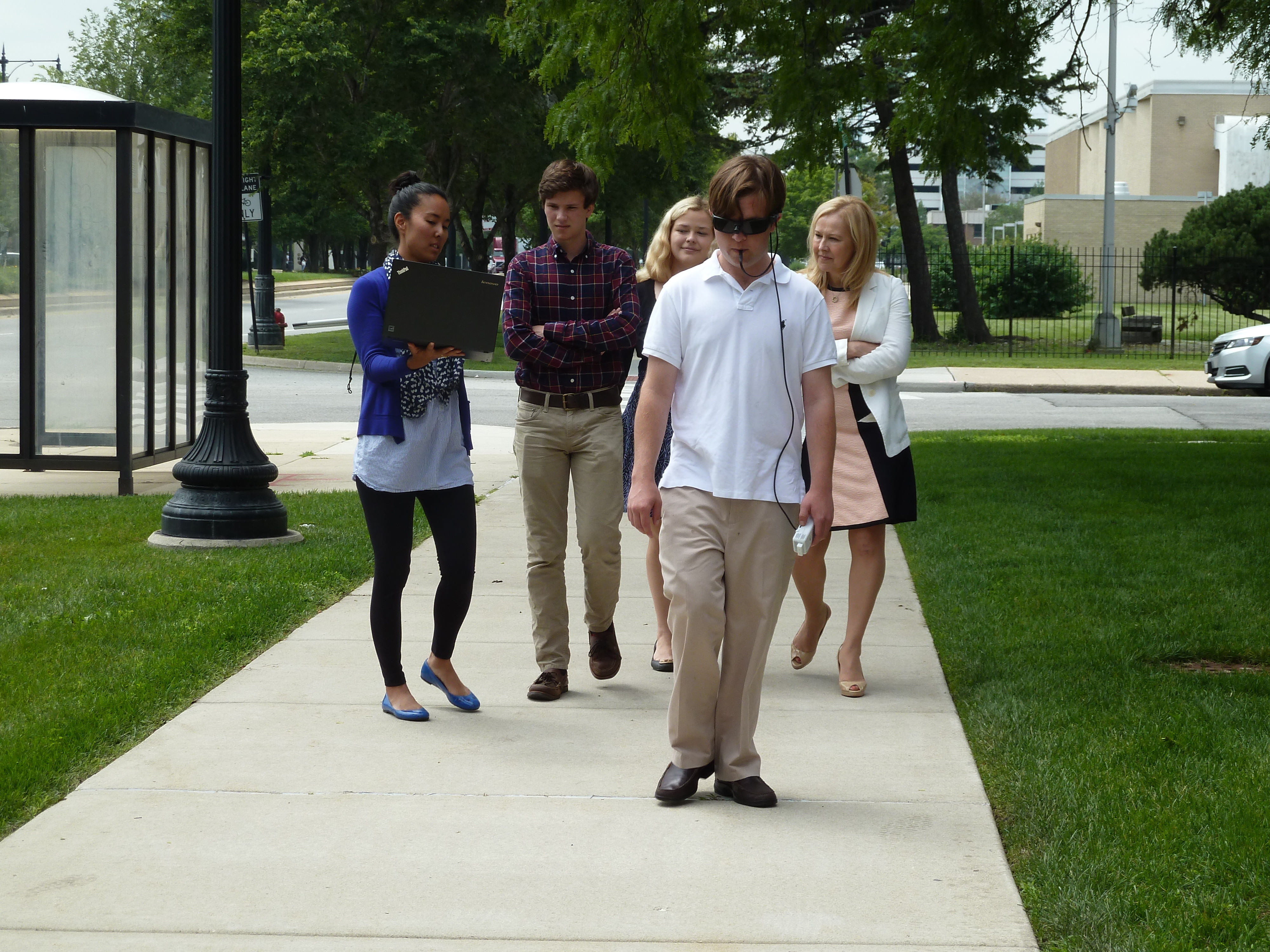 John Vickers demonstrates the BrainPort Device by walking alone on the sidewalk