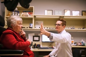 Doctor performing an eye exam on a patient