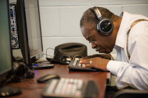 A man learns computing skills in the Seniors Program at The Chicago Lighthouse