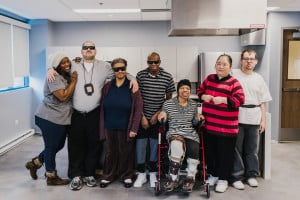 Six participants of the Adult Living Skills program along with a staff member in the new kitchen at The Chicago Lighthouse