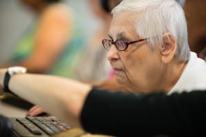 Member of Seniors Program learning computer skills