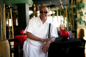 A blind worker, trained at The Chicago Lighthouse, shown with his white cane at his place of employment