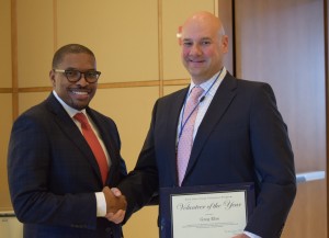BCBSIL President Maurice Smith congratulates volunteer of the year Greg Else