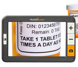 The explore 5 is seen in front of bottle of pills, which shows magnified on its screen.