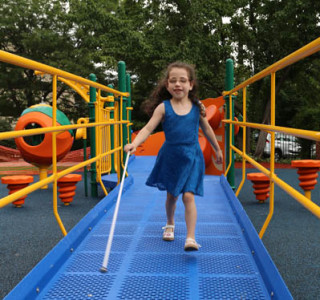 A visually impaired child playing.