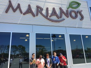 The participants of the First Jobs stand outside at Mariano's