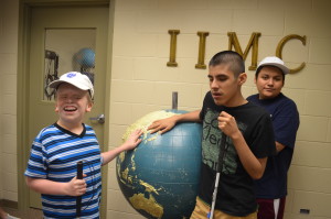 Participants Ivan, Daniel and Franklin feel a tactile globe