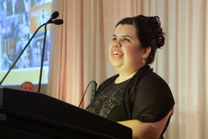 Sandy Murillo at the podium stand during the Gala live auction