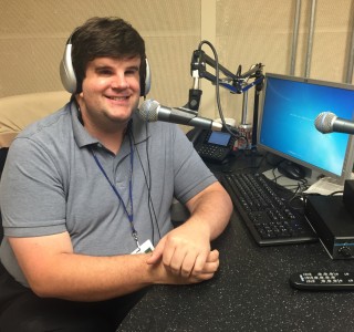 A photo of Brett at his desk.