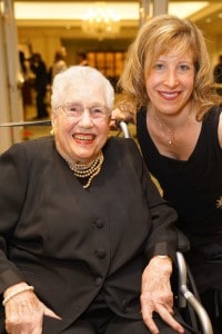 Mrs. Mayer smiles next to Jen Miller during a gala for The Chicago Lighthouse