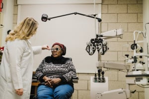 A doctor in The Chicago Lighthouse Low Vision Clinic works with a patient.
