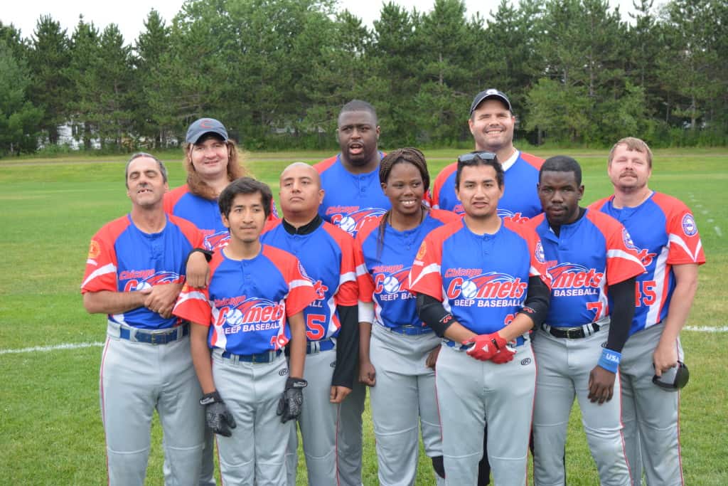 The Chicago Comets beep ball team smiles as a group. 