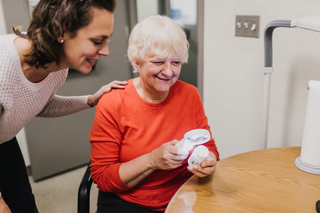 Laura Hayes works with a patient.