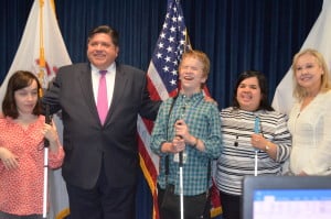 Group shot of Chicago Lighthouse Interns Hannah and Daniel along with their CRIS supervisor Sandy and Lighthouse CEO Dr. Janet Szlyk pose with Governor Pritzker