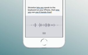 Image of an iPhone using the dictation feature with dictated text saying, "Dictation lets you speak to the keyboard on your iPhone, that way you can use it hands free!