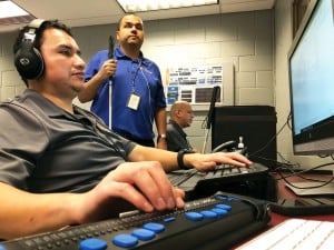 Jose Martinez (middle) supervises while Juan Gonzalez (left) and Geovanni Bahena (right) work to improve the accessibility of websites for people with visual impairments. All three are legally blind.