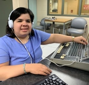 Sandy uses audio engineering equipment in her job at The Chicago Lighthouse's CRIS Radio.