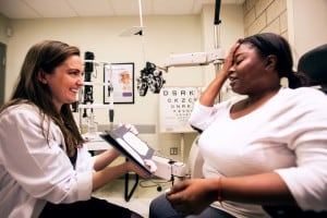Dr. Kelly Scherer working with a patient in the Low Vision Clinic