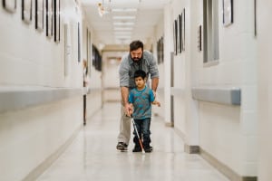 Jaret Bozigian teaching a preschool to navigate using a cane