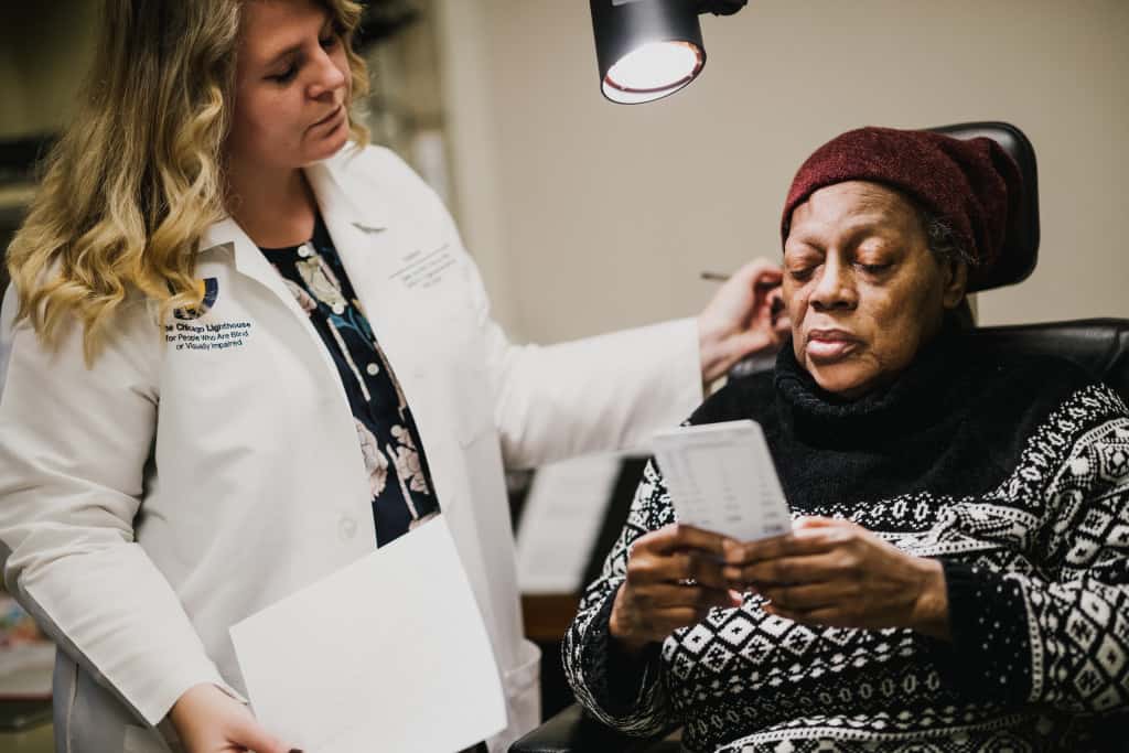 Patient receiving an eye exam from a doctor at the chicago lighthouse