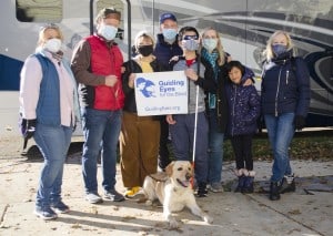Flyer the dog, with his new family, Woody from Guiding Eyes for the Blind, and Dr. Janet Szlyk from the Chicago Lighthouse