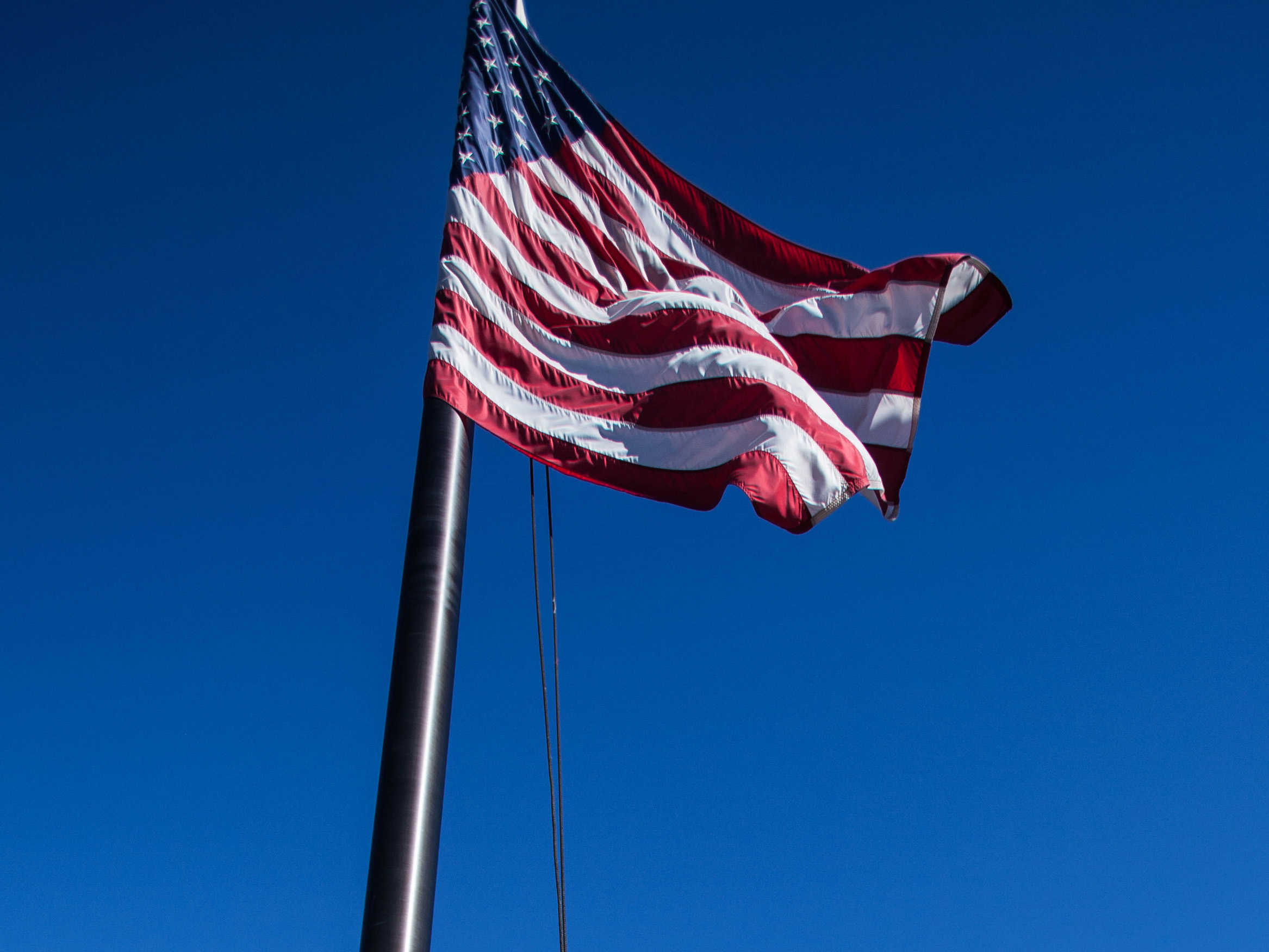 American flag flying outside on a pole
