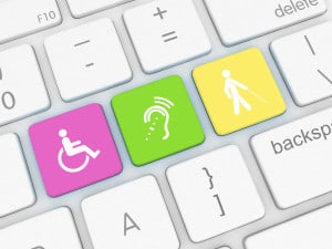 close up graphic of a computer keyboard with three special keys: 1) a wheelchair icon; 2) a hearing icon; 3) an icon of a person with a white cane