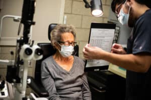 Woman receiving an eye exam in the Chicago Lighthouse Low Vision Clinic