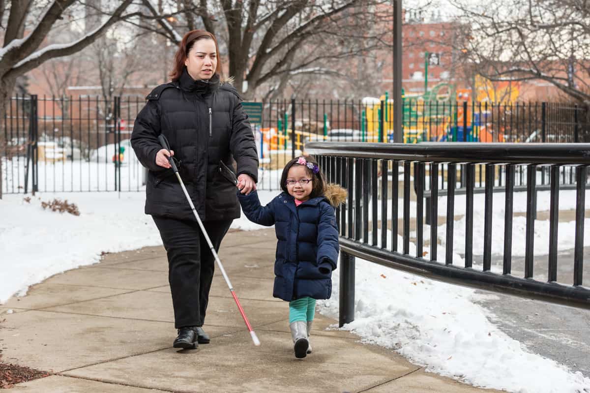 Juan's wife Liz and daughter Karen enjoy a walk outside