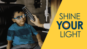 Message: Shine Your Light with image of a little boy receiving an eye exam