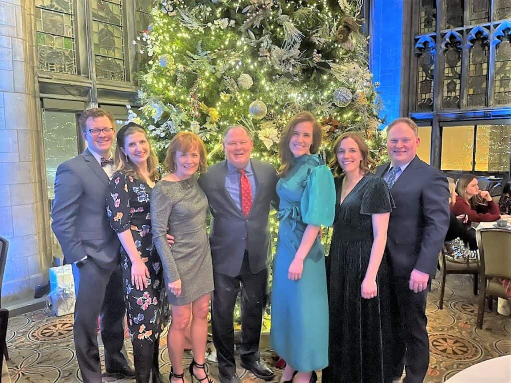A posed family photo in front of a Christmas tree with Don Duncan and his family.