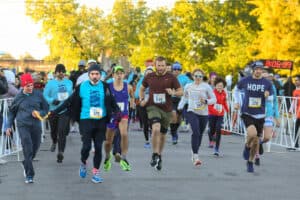 Runners and walkers start the Rise to Shine race in 2023