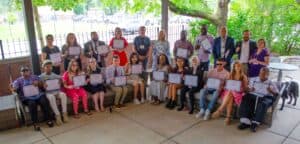 The 2024 Lader Scholarship recipients pose as a group on The Chicago Lighthouse patio along with Dr. Janet Szlyk, Board Member David Huber and Keynote Speaker Peter Tucic.