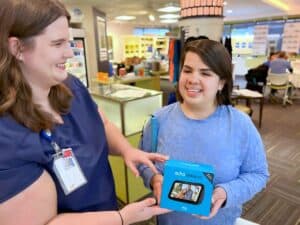 Sandy receiving an Amazon Echo Show in the My Tools for Living Store.