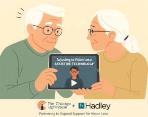Two older individuals viewing a tablet screen displaying a video titled "Adjusting to Vision Loss: Assistive Technology" with logos of The Chicago Lighthouse and Hadley shown, symbolizing their partnership.