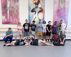 members of the Youth Transition group pose for a photo during a ballet class